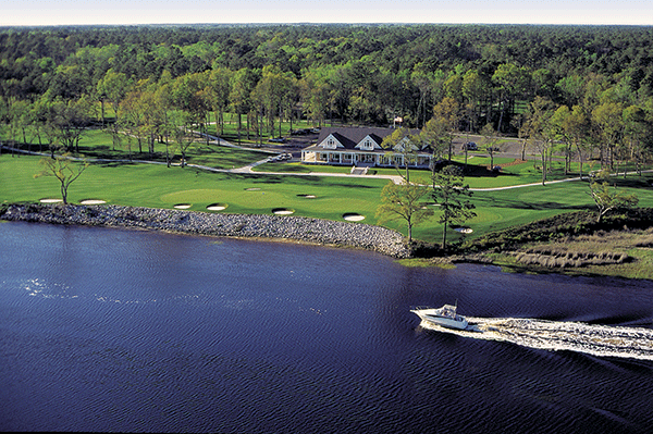 The clubhouse at Glen Dornoch overlooks the 9th and 18th greens, in addition to the waterway